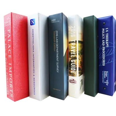 A row of custom printed binders standing on end